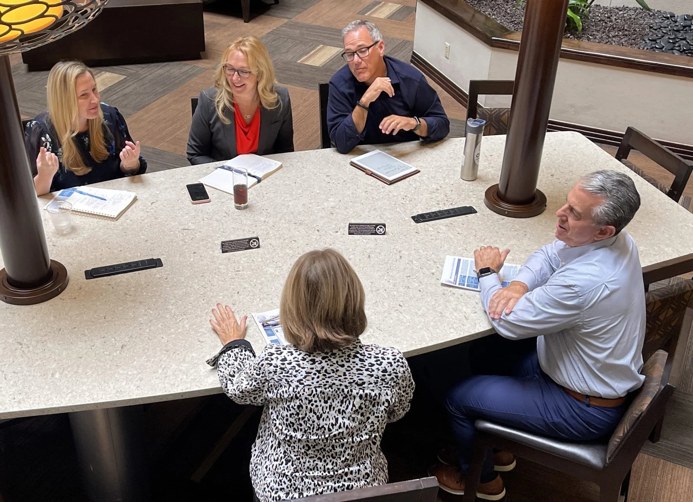 Small group around a table during a PBCA training